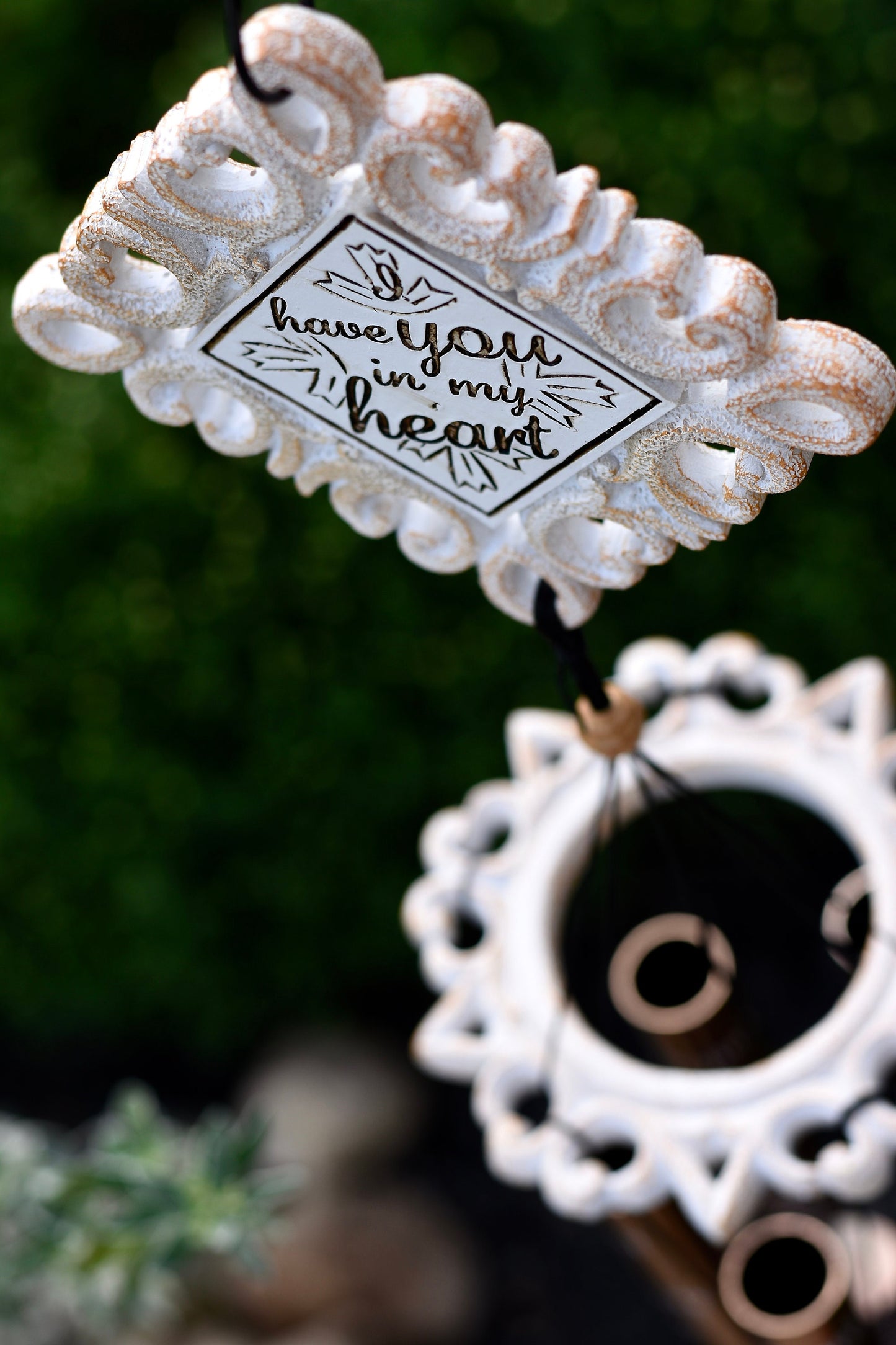 Memorial wind chime displayed outdoors as a sympathy gift, offering comfort and remembrance for the loss of a loved one